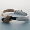 Pulsera Ormé Edition de plata rodiada con cuero color topo